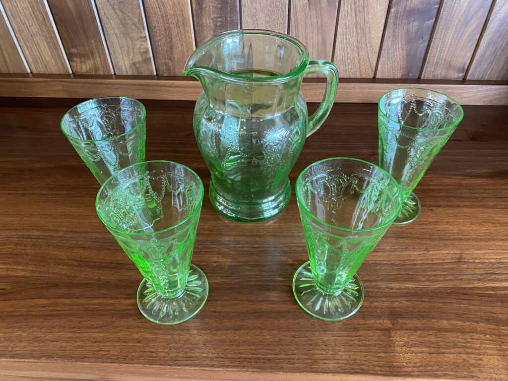 green depression glass pitcher and glasses