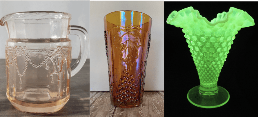 From left to right: a pink depression glass pitcher, an amber carnival glass tumbler, and a uranium glass vase
